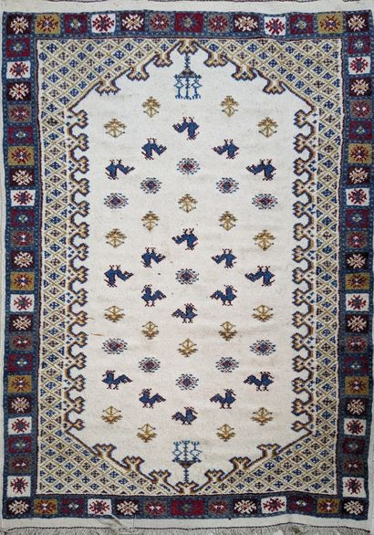 Tapis en laine à décor polychrome d'oiseaux...