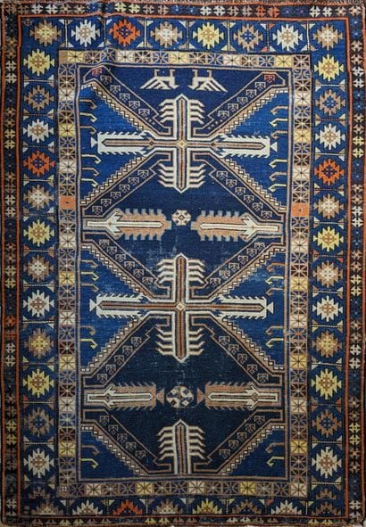 Tapis d'Orient en laine, à décor de motifs...