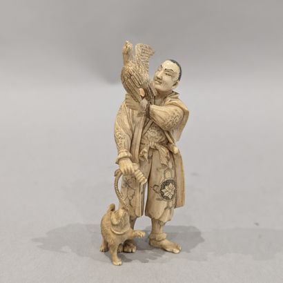 Okimono composition depicting a falconer...