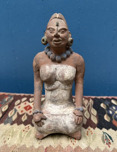 Pre-Columbian art. Statuette of a woman seated...