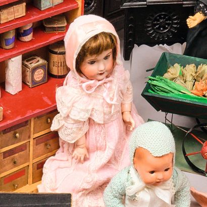 Doll. Porcelain head, ribbed glass eyes,...