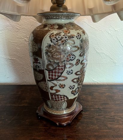 Ceramic vase in the Satsuma style. On a carved...