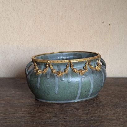 Small ovoid planter in green enameled stoneware...