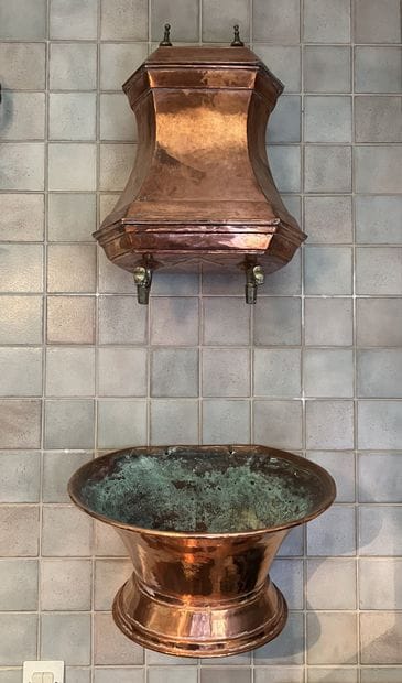 Red copper fountain and basin.