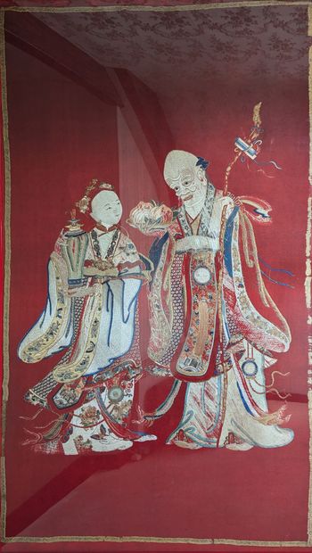 Large embroidery on red felt depicting a...