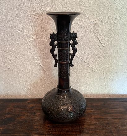 Japan, 20th century. Patinated bronze vase...