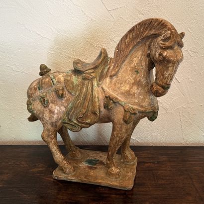 Tang-style patinated terra cotta horse. H....