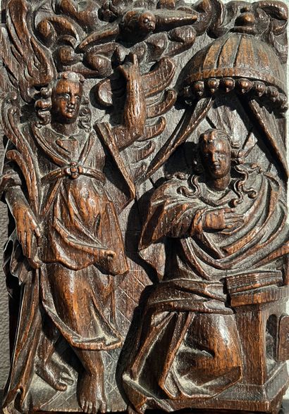 Carved wooden panel depicting the Annunciation....