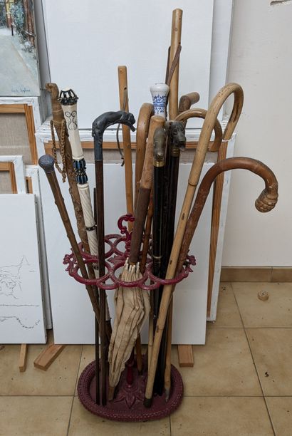 Lot of canes, some with metal handles featuring...
