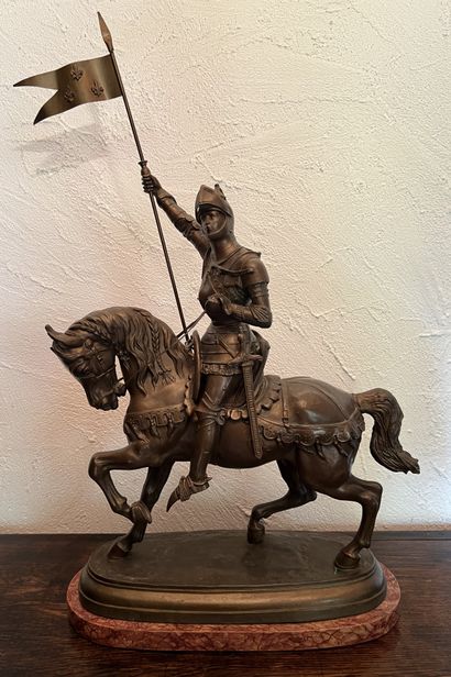 Statue of Joan of Arc on horseback in armor,...