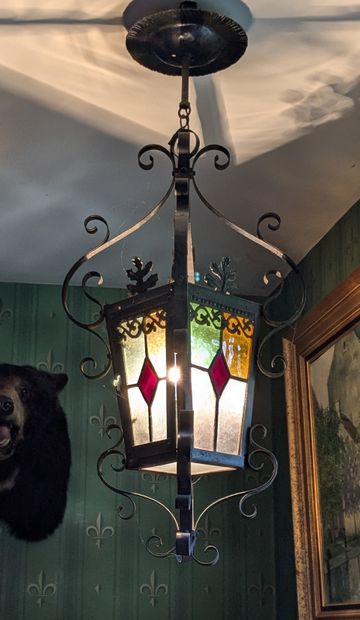 Lantern, black patinated wrought-iron frame...