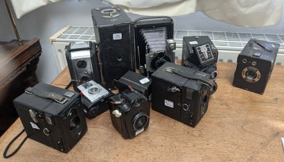 A set of cameras, most of them box cameras,...