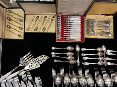 In a few cases, cake forks and metal tea...
