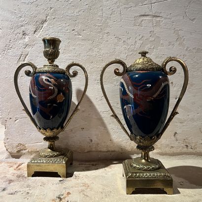 Pair of bronze torches, the body enamelled...