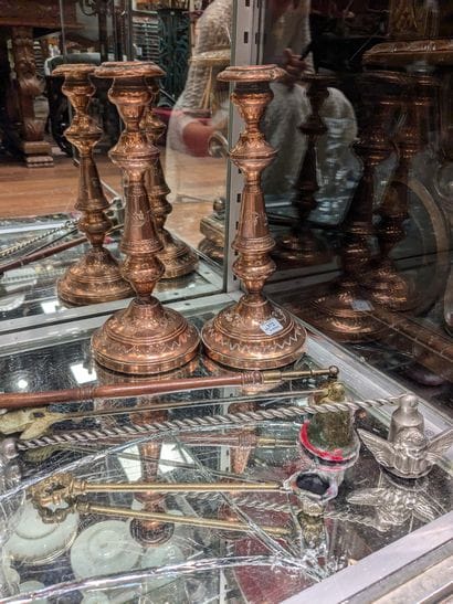 Trinkets: pair of red copper torches, decorated...