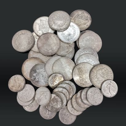 Vingt pièces de cinquante francs en argent...
