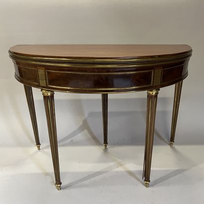 Mahogany and mahogany veneer half-moon table...