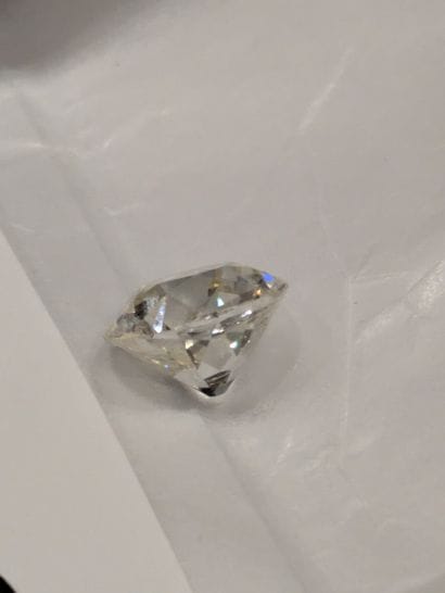 Platinum-set ring set with three small falling...
