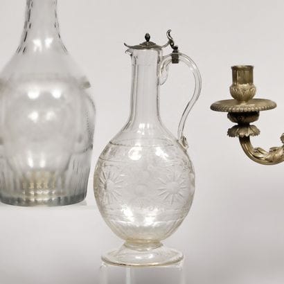 Cut and engraved crystal ewer, the neck decorated...