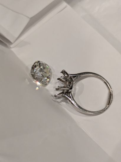Platinum-set ring set with three small falling...