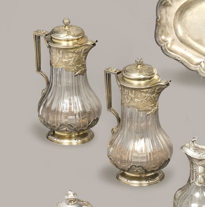 A pair of baluster-shaped, wide-ribbed crystal...