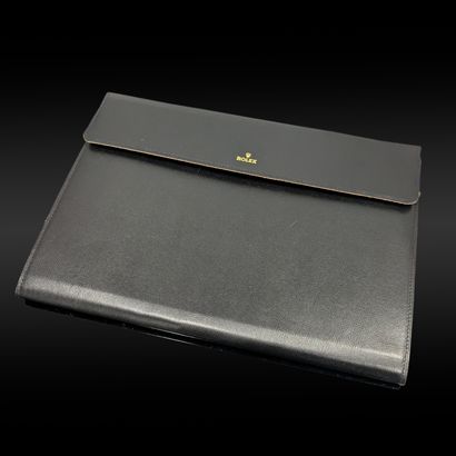 ROLEX. Black and brown grained leather pouch....