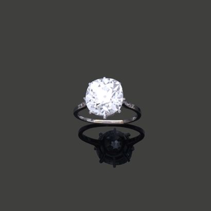 Platinum-set ring set with three small falling...