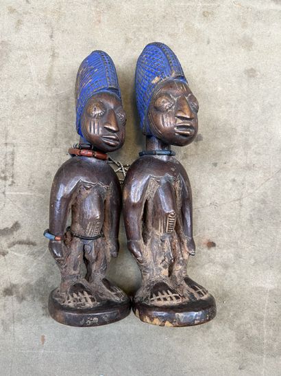 Pair of male Ibeji twins in patinated wood,...