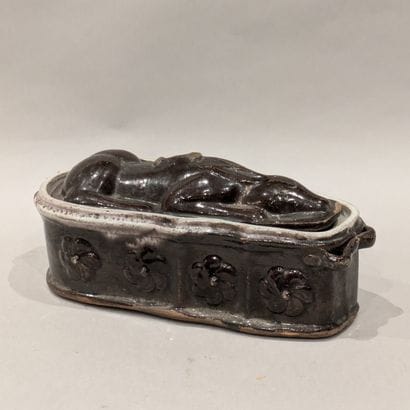 Small brown and white enameled terra cotta...