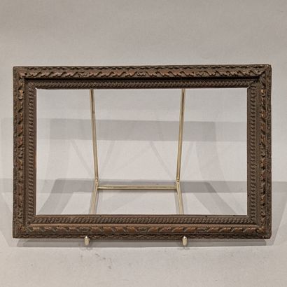 Small carved boxwood frame with foliage scrolls....