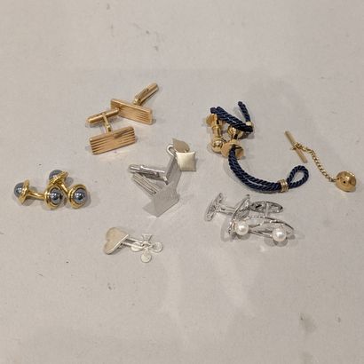 Set of fancy metal cufflinks and collar ...