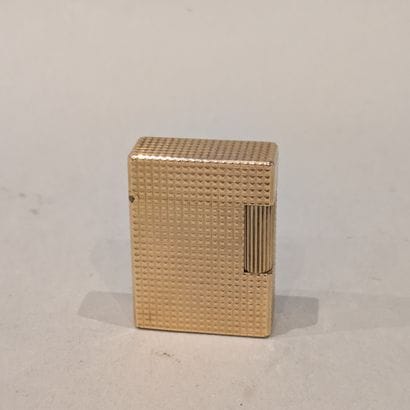 S.T. DUPONT. Gilded metal lighter with diamond...