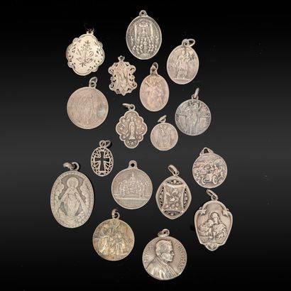 Set of seventeen religious medals in silver...