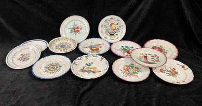 A dozen regional earthenware plates, mainly...