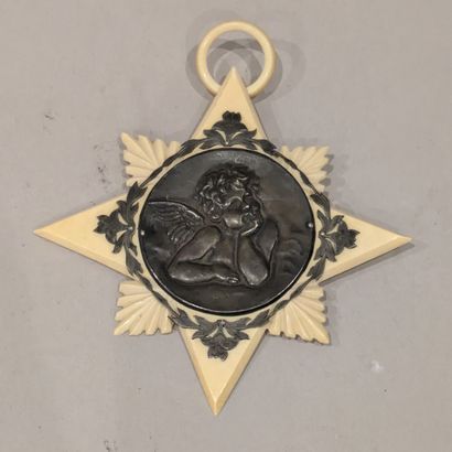 Star-shaped ivory pendant adorned with a...
