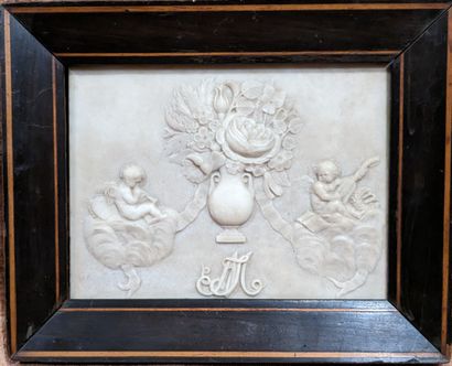 Alabaster plaque decorated in light relief...