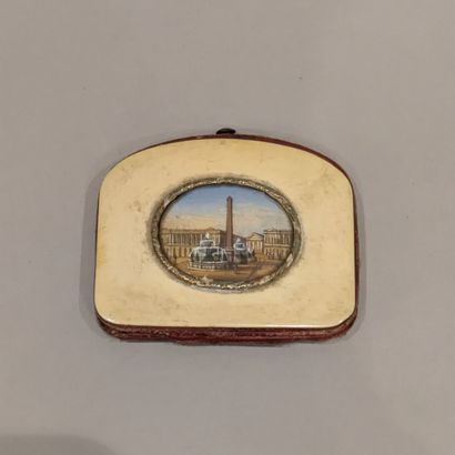 Small purse, ivory dishes, top part arched....