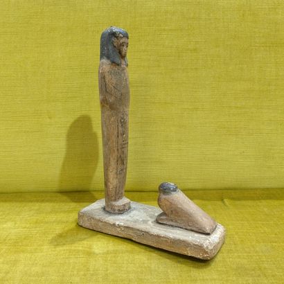 Painted wood sculpture depicting Horus facing...