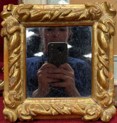 Small giltwood frame decorated with spandrels...