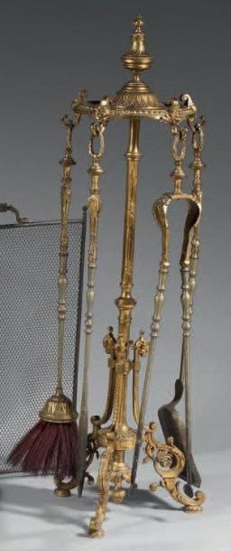 Porte-pelles et pincettes en bronze doré...