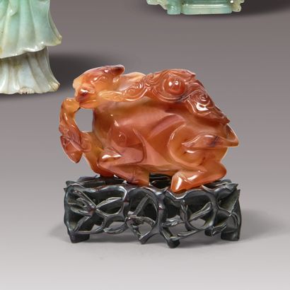 CHINA - 20th century. Carved carnelian group...