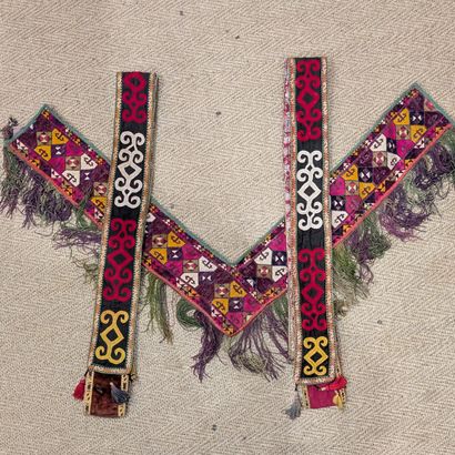 Two bands embroidered with stylized scroll...