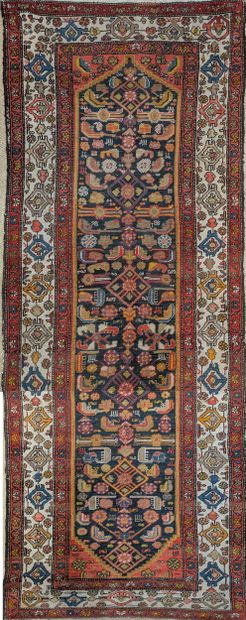 Oriental wool carpet decorated with stylized...