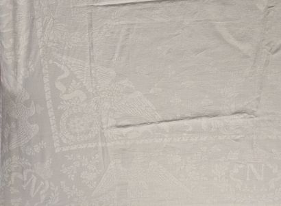 Large white damask dinner service decorated...