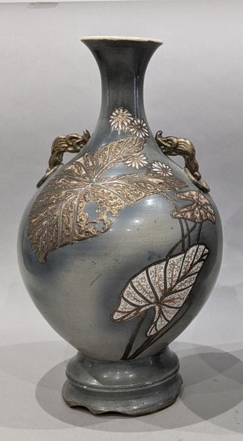 Japanese porcelain vase with a gray background...