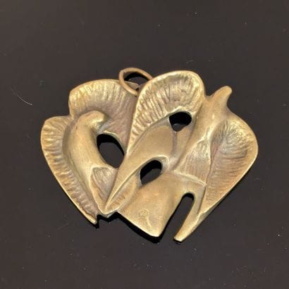 Modern work. Gilt bronze pendant representing...