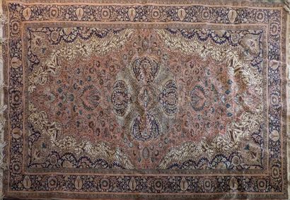Oriental wool carpet with oval rosette in...