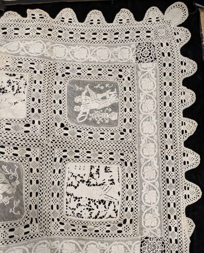Crochet lace tablecloth with appliqué. Decorated...
