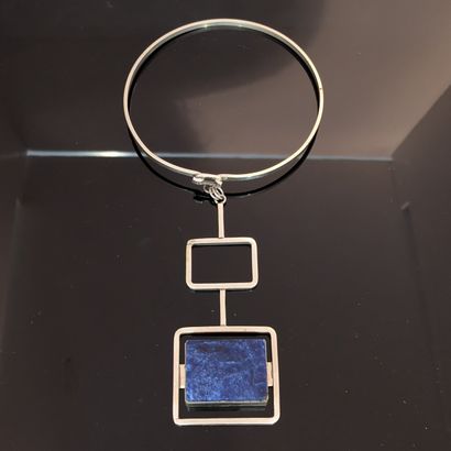 Modern work. Silver-plated metal pendant...