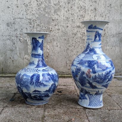 Two porcelain baluster vases with flared...